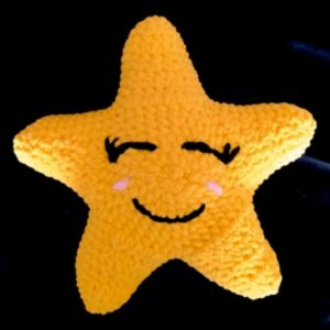 yellow crochet star pillow